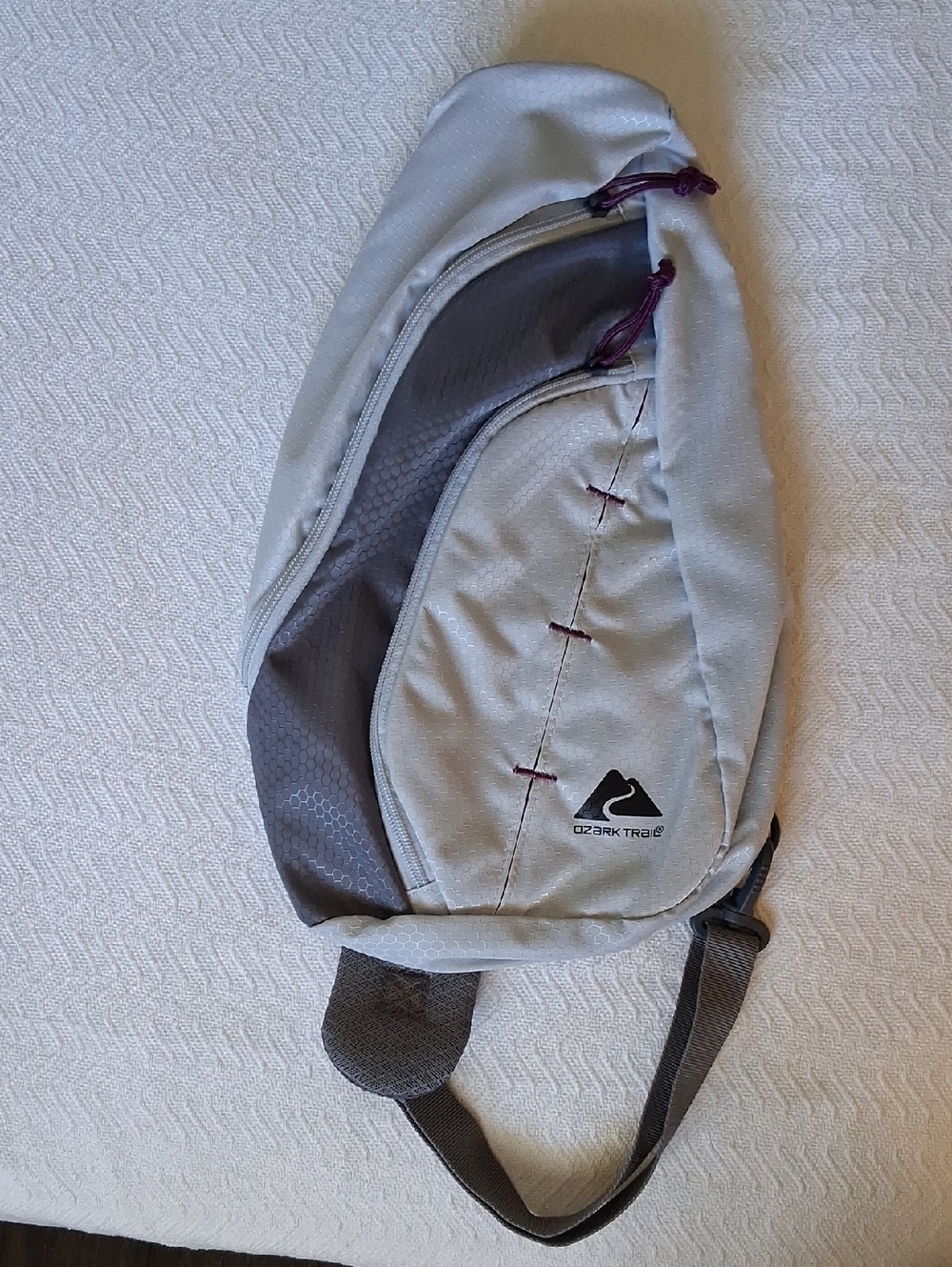 Ozark Trail Sunset Sling Bag with Dark Gray Panels and Purple Accents